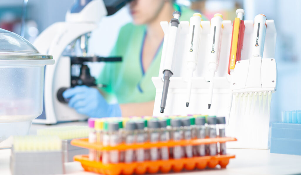 Female scientist performing liquid-based and tissue-based biopsies